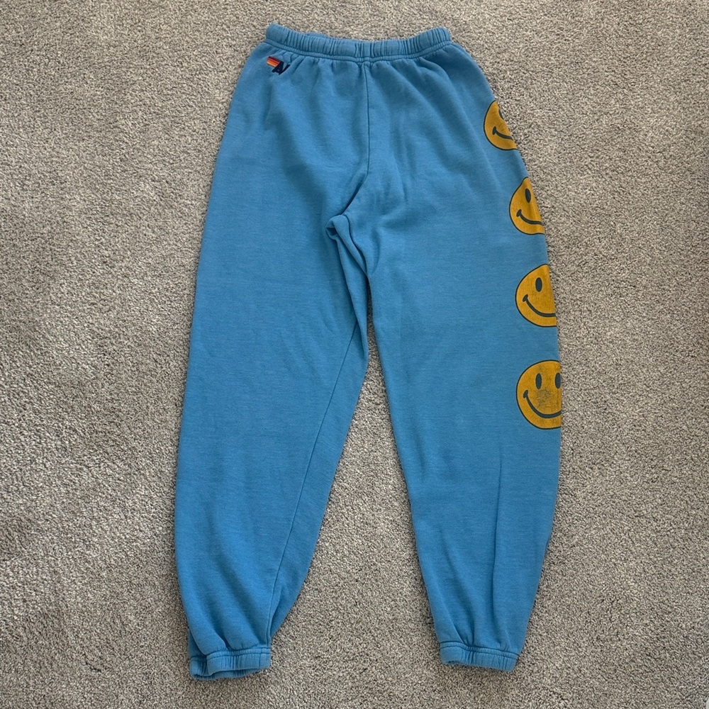 Aviator Nation Blue sweatpants with Smiley Face Design